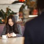 young adult validating used electronics condition for a local digital marketplace