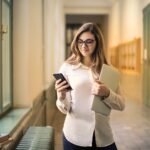 How to Get a Free iPad and Laptop Through Federal Student Aid Programs College student receiving a free iPad and laptop through federal student aid programs