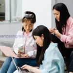 How to Pay Off Student Loans Early: A Student & Parent Guide (2026 Rules) A detailed look at a student financial aid offer letter on a wooden desk next to a pen and calculator.