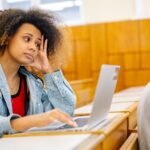 What Is Happening with Student Loans in July 2026? The Critical SAVE Plan Updates stressed college student reviewing federal student loan statements
