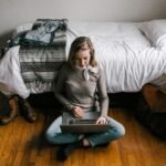 freelance college student creating digital files for an e-commerce shop