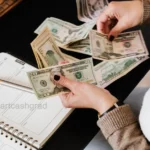 Parent PLUS vs Private Student Loans: The Brutal Honest Truth A stressed young adult sitting on a dorm bed looking at stacks of bills and tuition paperwork.