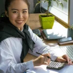 A young student in the US reviewing a tax calculator on their laptop learning how much can a student make per year without paying taxes safely